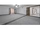 Generously sized living area with neutral carpet, ceiling fan, and archway entries for seamless flow at 13014 N 23Rd Pl, Phoenix, AZ 85022