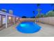 Inviting backyard pool with custom lighting, surrounded by patio space for outdoor relaxation and enjoyment at 13014 N 23Rd Pl, Phoenix, AZ 85022