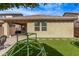 Backyard featuring artificial turf and a geometric climbing structure at 13225 W Rowel Rd, Peoria, AZ 85383