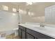 The bright bathroom features a tub shower combo and vanity with plenty of counterspace at 13225 W Rowel Rd, Peoria, AZ 85383