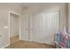 Another view of the bedroom showing the closet, entry door and fun decor at 13225 W Rowel Rd, Peoria, AZ 85383