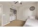 One of the secondary bedrooms features an organizational closet and cute decor at 13225 W Rowel Rd, Peoria, AZ 85383