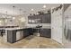 Modern kitchen with stainless steel appliances, granite countertops, and ample cabinet space at 13225 W Rowel Rd, Peoria, AZ 85383