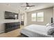 This main bedroom is bright with many windows and features an attached bathroom and dresser at 13225 W Rowel Rd, Peoria, AZ 85383