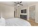 Relaxing main bedroom with mounted TV and an attached bathroom featuring a glass enclosed shower at 13225 W Rowel Rd, Peoria, AZ 85383