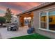 Beautiful backyard with patio, outdoor kitchen, and faux grass at 1407 E Artemis Trl, San Tan Valley, AZ 85140