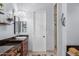 Bathroom featuring granite countertops, elegant lighting, and a glass-enclosed shower at 1407 E Artemis Trl, San Tan Valley, AZ 85140