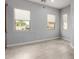 Bright bedroom with tile floors, neutral paint, and sunlit windows at 1407 E Artemis Trl, San Tan Valley, AZ 85140