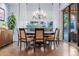 Dining room featuring a large table, seating for six, and sliding doors to the backyard at 1407 E Artemis Trl, San Tan Valley, AZ 85140