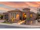 Charming single-story home with a tile roof, landscaped front yard, and walkway with inviting lighting at 1407 E Artemis Trl, San Tan Valley, AZ 85140