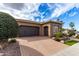 Inviting single-story home with an attached garage and desert landscaping at 1407 E Artemis Trl, San Tan Valley, AZ 85140