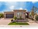 Charming single-story home with well-manicured front yard, desert landscaping, and neutral exterior paint at 1407 E Artemis Trl, San Tan Valley, AZ 85140