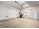 Spacious two car garage with sealed floors, utility sink and bright overhead lighting at 1407 E Artemis Trl, San Tan Valley, AZ 85140