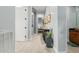Hallway with tile floors, neutral walls, and recessed lighting leading to the bedroom at 1407 E Artemis Trl, San Tan Valley, AZ 85140