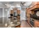Spacious kitchen features custom cabinets, stainless steel appliances, and hardwood flooring at 1407 E Artemis Trl, San Tan Valley, AZ 85140