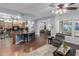 Open-concept living space showing the kitchen island, dining area, and comfortable seating at 1407 E Artemis Trl, San Tan Valley, AZ 85140