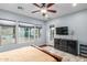 Bright main bedroom with dresser, windows and back patio access with an outdoor view at 1407 E Artemis Trl, San Tan Valley, AZ 85140