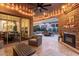 Outdoor patio with string lights, brick fireplace and dining area at 1407 E Artemis Trl, San Tan Valley, AZ 85140