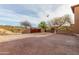 Wide brick driveway leads to a charming property with a gated entrance, and desert landscaping at 14402 N Lost Tank Trl, Fort McDowell, AZ 85264