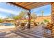 Outdoor patio with a heated pool and spa, outdoor seating, BBQ, and beautiful desert views at 14402 N Lost Tank Trl, Fort McDowell, AZ 85264