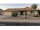 Inviting single-story home featuring desert landscaping, a covered porch, and an attached two-car garage at 14710 W Antelope Dr, Sun City West, AZ 85375