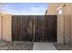 Wood and metal gate, providing secure and private access to the property at 16055 W Anasazi St, Goodyear, AZ 85338