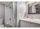 Well-lit bathroom featuring a shower-tub combo and a modern vanity with chrome fixtures at 16402 N 31St St # 102, Phoenix, AZ 85032