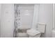 Bathroom featuring a shower with tiled walls, modern fixtures, and a clean, bright aesthetic at 16402 N 31St St # 102, Phoenix, AZ 85032