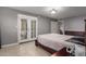 Bedroom featuring access to the outdoor space, neutral-colored walls, and a cozy, inviting atmosphere at 16402 N 31St St # 102, Phoenix, AZ 85032