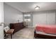 Bedroom featuring tile floors, neutral walls, a closet, and a comfortable bed at 16402 N 31St St # 102, Phoenix, AZ 85032