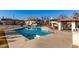 Large community pool surrounded by a spacious deck, perfect for relaxation and recreation at 16402 N 31St St # 102, Phoenix, AZ 85032