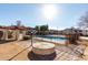 Community pool area, surrounded by well-maintained landscaping and various residential buildings at 16402 N 31St St # 102, Phoenix, AZ 85032