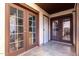 Welcoming entrance with elegant double doors and tiled flooring for a stylish entry at 16402 N 31St St # 102, Phoenix, AZ 85032