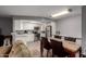 Open-concept living space with modern kitchen, dining area, and a comfortable living room setup at 16402 N 31St St # 102, Phoenix, AZ 85032