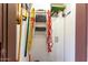 Organized storage space with hanging tools and a closed cabinet for maximum utilization at 16402 N 31St St # 102, Phoenix, AZ 85032