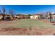 Well-maintained tennis court in a community setting, surrounded by lush landscaping and buildings at 16402 N 31St St # 102, Phoenix, AZ 85032
