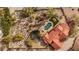 An aerial view of the house sitting on a large lot featuring a backyard pool and patio at 16522 E Glenbrook Blvd, Fountain Hills, AZ 85268