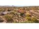 An elevated view of this desert home with mountain views and mature landscaping at 16522 E Glenbrook Blvd, Fountain Hills, AZ 85268