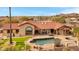 Backyard featuring a pool, spa, covered patio, artificial turf, and a mountain view at 16522 E Glenbrook Blvd, Fountain Hills, AZ 85268