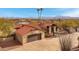 Beautiful single-Gathering home featuring well-kept landscaping, neutral stucco, and a tile roof at 16522 E Glenbrook Blvd, Fountain Hills, AZ 85268