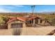 Beautiful home featuring well-kept landscaping, neutral stucco, desert landscaping, and a tile roof at 16522 E Glenbrook Blvd, Fountain Hills, AZ 85268