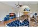 Spacious living room featuring hardwood floors, a modern fan, and natural light at 16522 E Glenbrook Blvd, Fountain Hills, AZ 85268