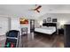 Spacious main bedroom featuring wood floors, vaulted ceilings, ceiling fan, and sliding glass door at 16522 E Glenbrook Blvd, Fountain Hills, AZ 85268