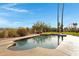 Backyard pool featuring a stone patio, desert landscaping, and mountain views at 16522 E Glenbrook Blvd, Fountain Hills, AZ 85268