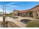Private backyard oasis featuring a luxurious pool, spa, and desert landscaping at 16522 E Glenbrook Blvd, Fountain Hills, AZ 85268