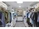 This impressive walk-in closet boasts custom organizers and ample storage space at 16522 E Glenbrook Blvd, Fountain Hills, AZ 85268