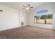 A large bedroom features a vaulted ceiling, ceiling fan, and private en-suite bathroom at 17201 N Chance Dr, Surprise, AZ 85374