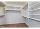 Walk-in closet with shelving and hanging racks for maximum storage and organization at 17201 N Chance Dr, Surprise, AZ 85374