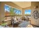 Relax on the cozy balcony with comfortable seating and enjoy the beautiful outdoor view at 19700 N 76Th St # 2044, Scottsdale, AZ 85255