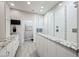 Bright bathroom featuring a tiled shower with glass partition and double vanity with granite counters at 19700 N 76Th St # 2044, Scottsdale, AZ 85255